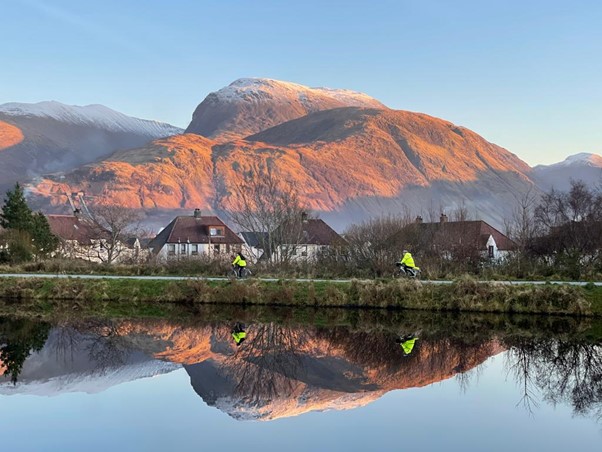 Scenic image of loch with mountains behind